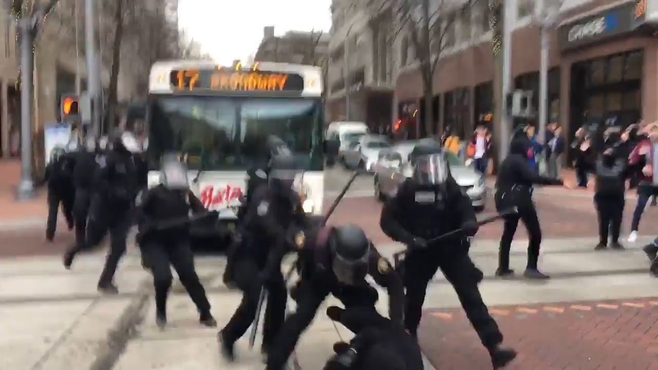 Image result for picture or portland oregon police beating demonstrators