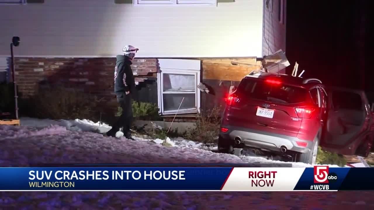 SUV crashes into home as resident was watching TV - YouTube