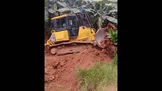 Komatsu D51EX Bulldozer Scrapes Soil To Widen Banana Plantation Road