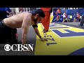 Marine veteran crawls across Boston Marathon finish line