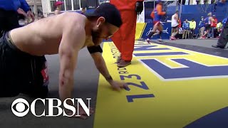 Marine veteran crawls across Boston Marathon finish line