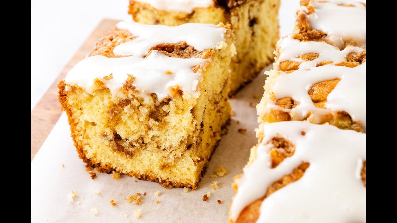 Easy cinnamon bun cake with gooey swirls and cream cheese glaze.