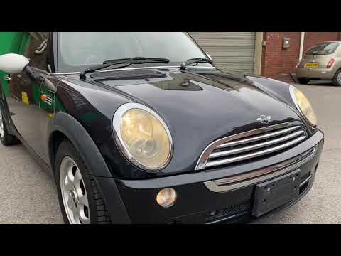 2006 Mini Cooper black with white roof