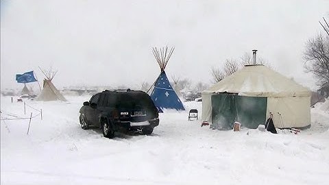 Dakota Access Pipeline protesters refuse to leave as snowstorm hits