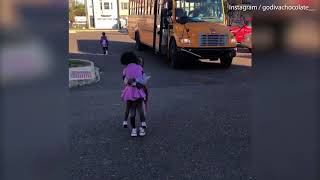 Heart warming moment sister greets brother from school bus