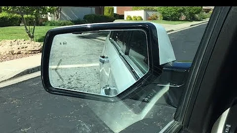 Tilt mirror in reverse setting: 2015 Yukon, Tahoe, Suburban, denali
