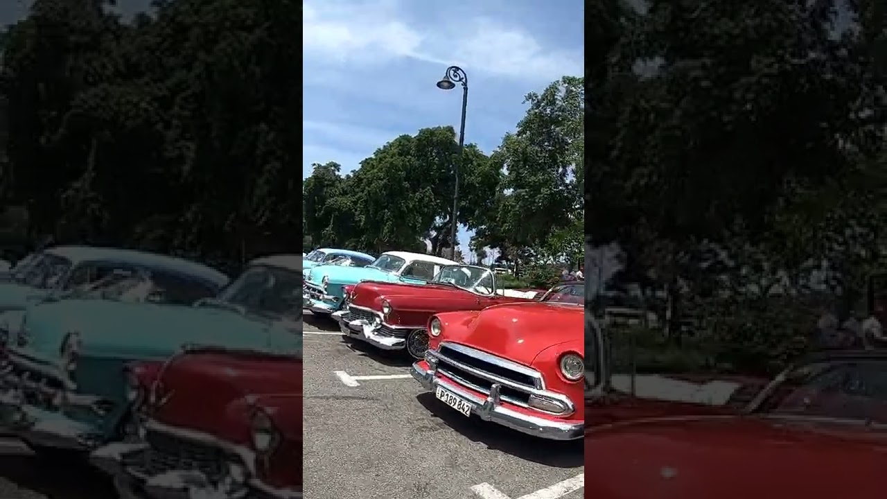 Person Showing Beautiful Classic Cars in Cuba