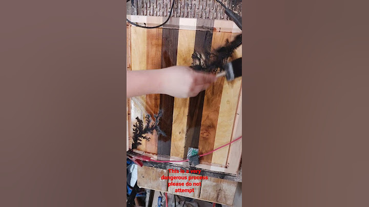 This process is Lichtenberg run high voltage electricity through wood making lightning tree patterns