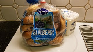 Enjoying Franz Blueberry mini bagels with Great Value whipped cream cheese for breakfast (OFL 1588)