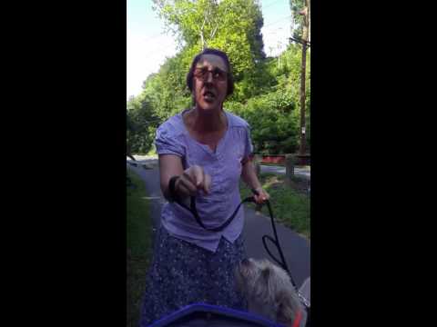 Insane woman assaults legal ebike rider for riding on public path