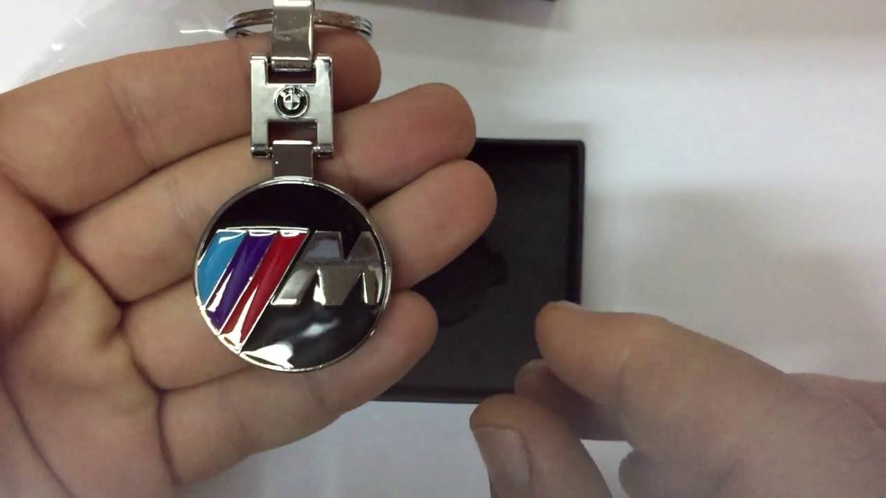 Брелок бмв что означают кнопки - фото