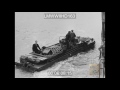 INVASION, FRANCE - GERMAN OBSTACLES ON BEACH; BRITISH SOLDIERS; FRENCH CIVILIANS SHOVE - LMWWIIHD163