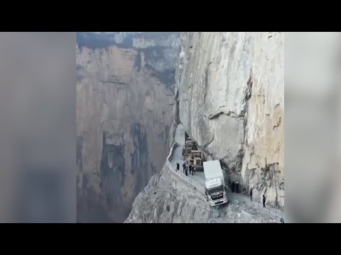 Truck pulled back on road after dangling over cliff for three days