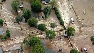 Trapped driver rescued as flash flooding hits California