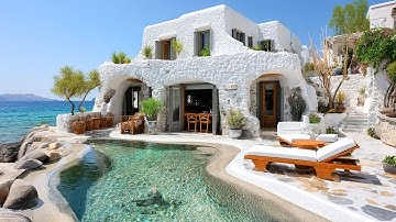 Whitewashed Greek House Design on a Cliff with Organic Architecture