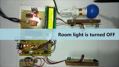 Automatic room light controller with visitor counter