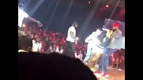 Lady faints on stage after hugging wizkid during performance
