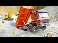 RC TRUCKS & CONSTRUCTION MACHINES IN ACTION// STUCKING RC TRUCK// DEMOLITION OF A HOUSE