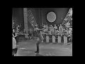 Backward flip with frontbend 1963