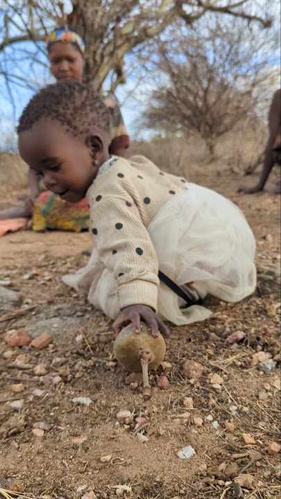 Tsunsa collecting the baobab seed for her mom