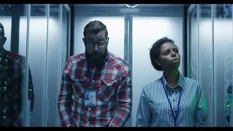 Engineers Walking In Server Room Stock Video