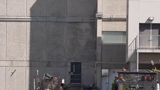 Learn the story behind how this creepy face appeared on the wall of a building in Galveston, Texas