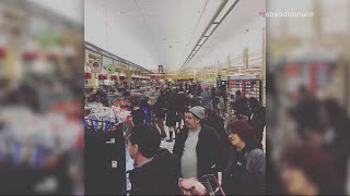 Shoppers empty grocery store shelves
