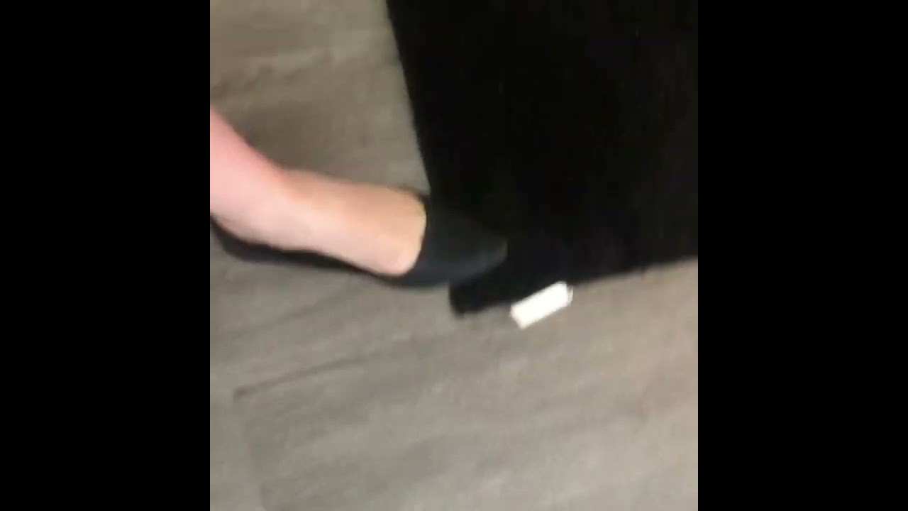 Short black flats dangle