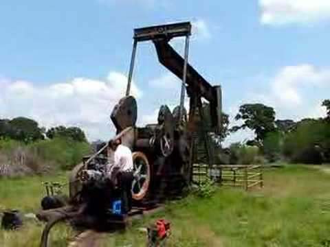 Changing the strokes per minute on a Lufkin pumpjack using an Ajax engine. Burleson County Texas. 5/27/2008 Oil Pumper www.oilpumper.com Derek's Oilfield Photography http