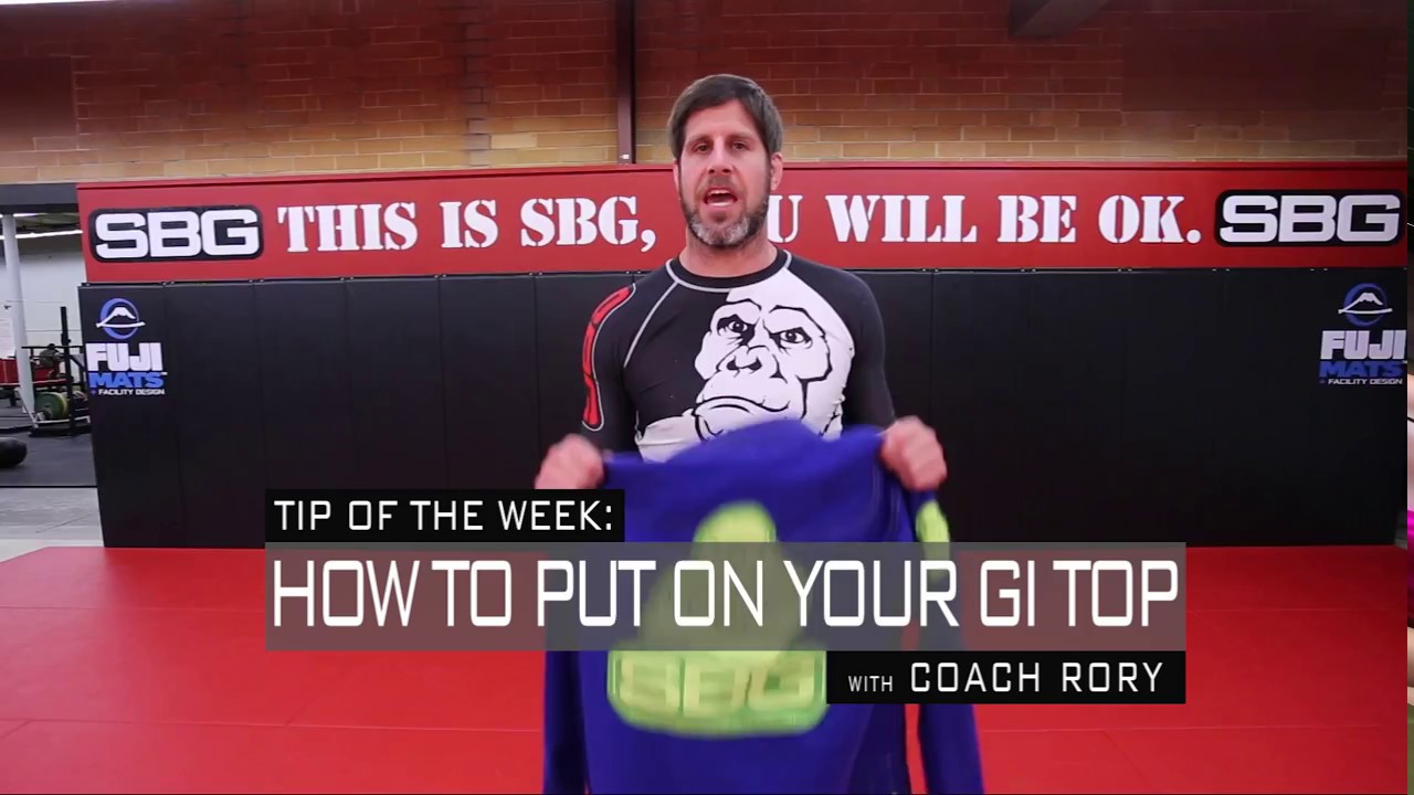 How to Properly Put on a Gi Top and Tie Your Belt - YouTube