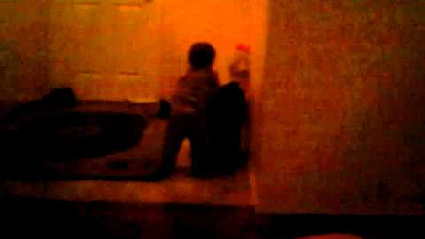 baby trying to push over grocery bag