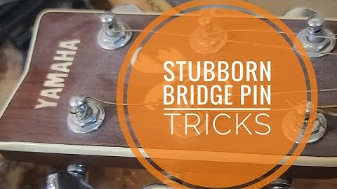Stuck bridge pins on your acoustic?