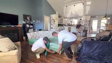 Plastic wrapping oversized light fabric couches