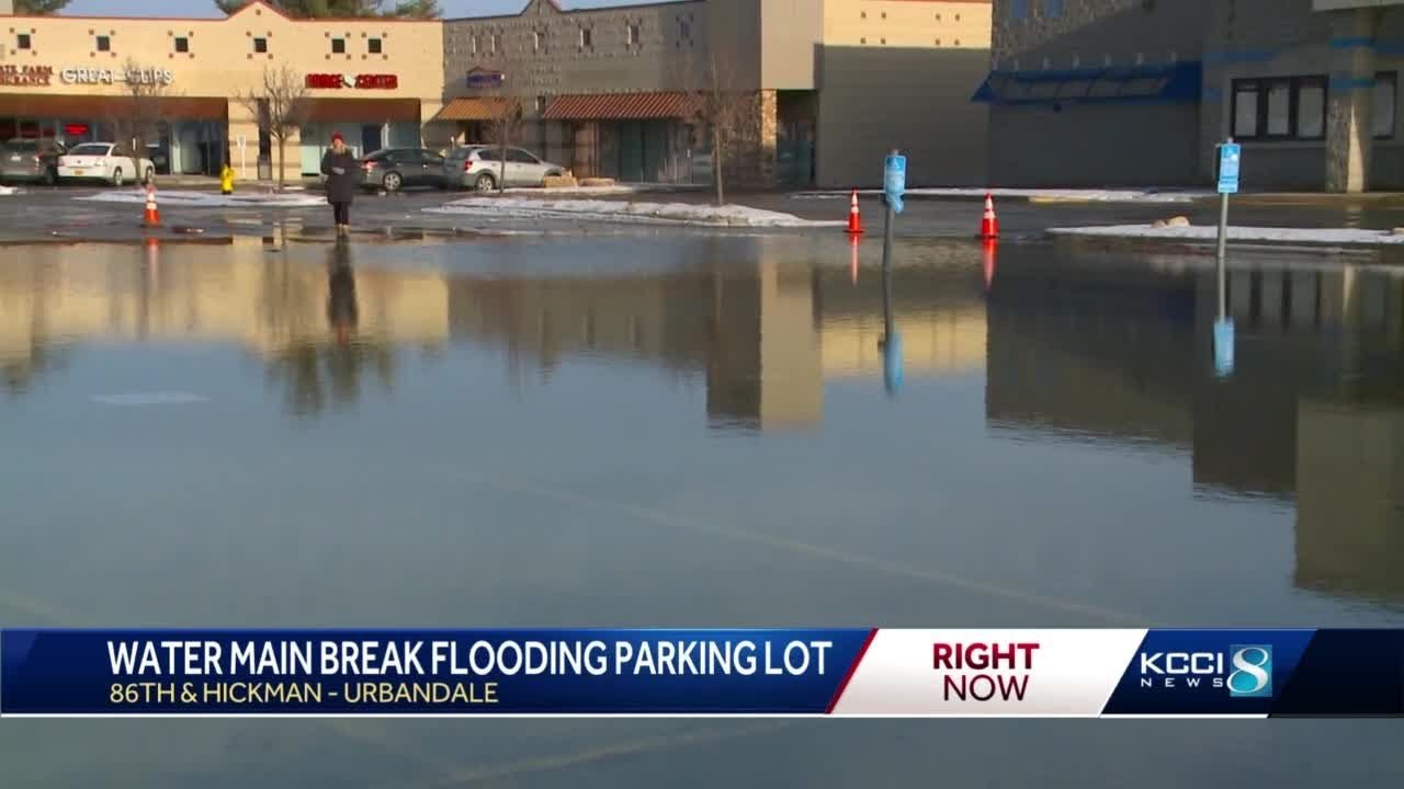 Water main break floods Urbandale parking lot YouTube