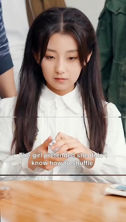 The girl pretended not knowing how to play card.