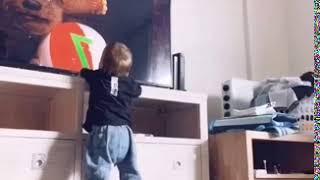 Guy pantsing his own kid.