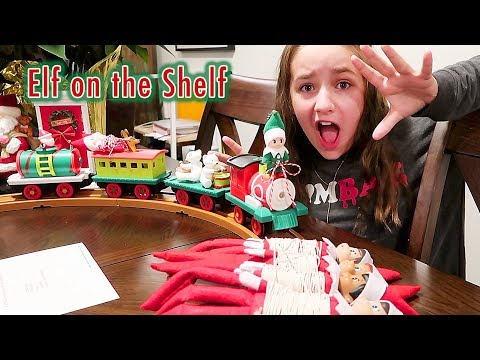 elf-on-the-shelf---green-prankster-baby-elf-rides-the-train!-can-i-save-them-by-solving-the-riddle?