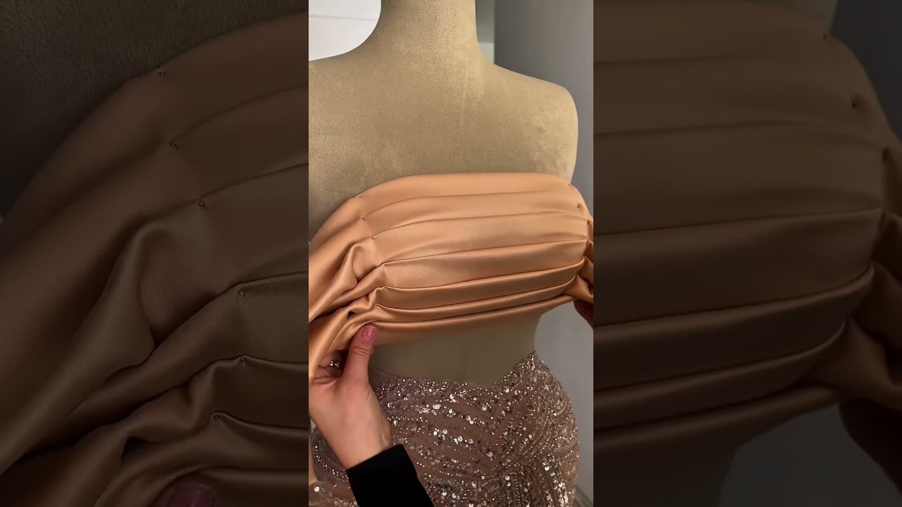 Share with a friend who would own the spotlight in this champagne sequin gown! To order, send us a