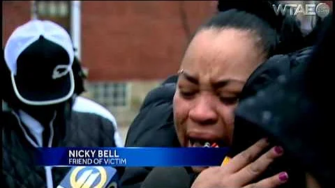 Vigil held while search for woman's killer continues