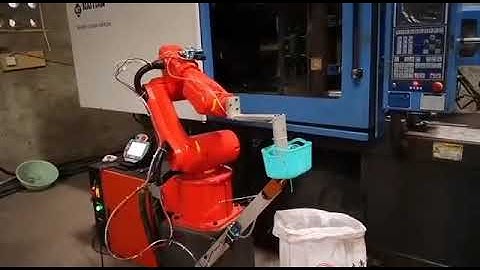The small industrial robot 950 to pick up products form Plastic Injection machine