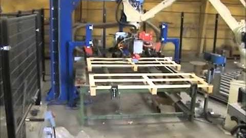 Motoman robots in production cell for bespoke size timber pallets