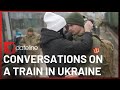 Ukrainians on a train speak about their lives a year into the Russian invasion | SBS Dateline