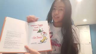 Diosa reading green eggs and ham by Dr.Seuss