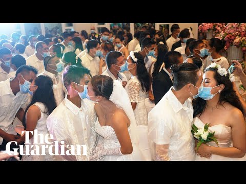 Couples marry wearing surgical masks over coronavirus fears