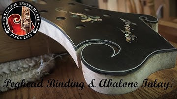 F-Style Peghead Binding & Abalone Inlay.