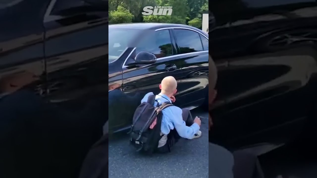 Eco Protester Hit By Car Door Then Knocked Over