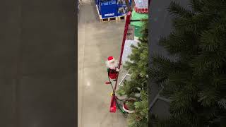 Santa climbing ladder