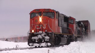 EMD SD70I! Extra Stack Train CN Q120 Kicking Up Fresh Snow near Upper Dorchester, NB at Track Speed