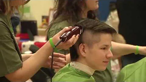Fire department shaves heads for childhood cancer research