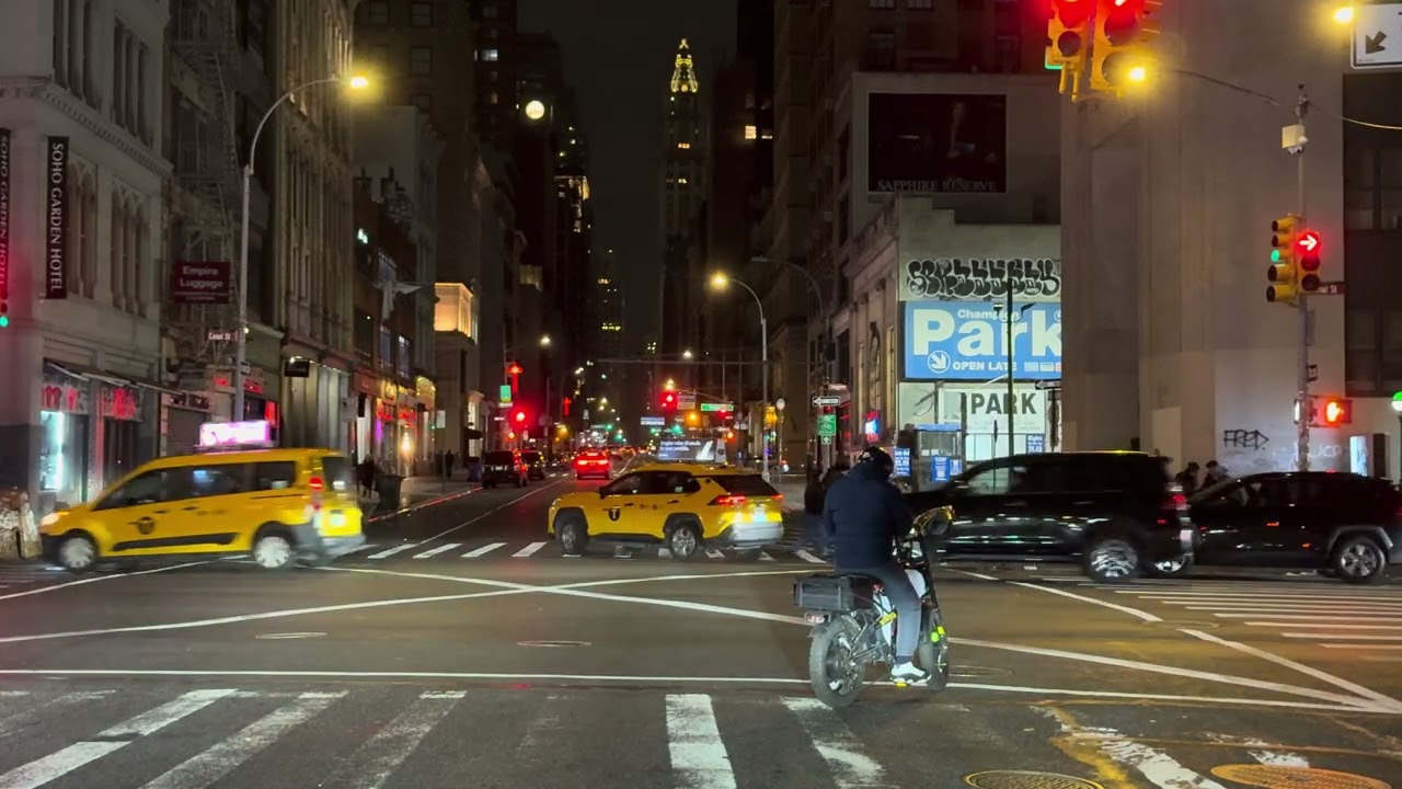A car ride along Broadway at night.